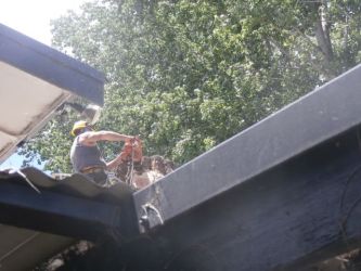 Alan Wallace on roof removing tree  - 1